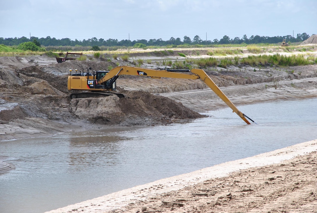 A contractor works in the intake canal as part of the C-44 Reservoir and Stormwater Treatment Area project near Indiantown in Martin County, Fla. The Jacksonville District Construction Division placed $385 million of work during Fiscal Year 2013, and leaders expect a bigger year in 2014.