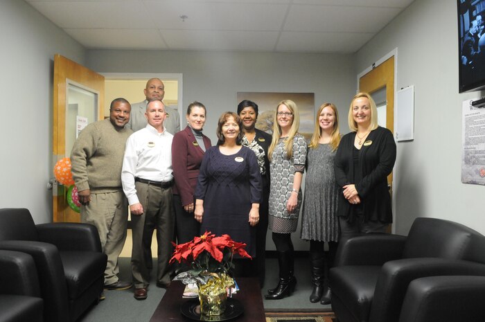 Several staff members of the new Community Counseling and Wellness Center at The Basic School pose in the lobby of the Community Counseling suite, one of four counseling suites that now occupy the second floor of Cox Hall. From left are community counselor Odis McKinzie, substance abuse counselor Thomas Brown (in back), victim advocate Chip Toney, New Parent Support Program home visitor Trish Burkes, Behavioral Health Program Director Laurie Wilson, Community Counseling clinical supervisor Stacie Gravlee, Family Advocacy Program counselor Jessica Crone and FAP prevention specialist Rebecca Childress. All but Childress and Wilson have offices in the new center. 
