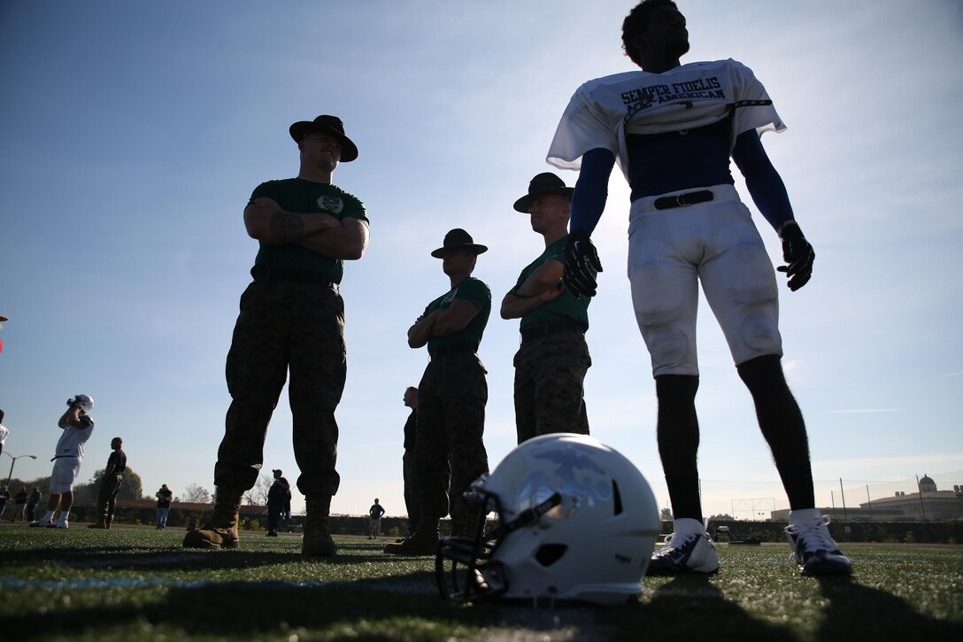 Marine Corps drill instructors from Marine Corps Recruit Depot San Diego engage East Team’s well-rounded student athletes from around the nation at Fullerton College in Fullerton, Calif., on Jan. 1, 2014, during practice for the Semper Fidelis All-American Bowl. The bowl brings selected players together with Marines and football coaches to develop skills not only important to football, but throughout life, such as leadership, self-confidence and teamwork. The SFAAB is scheduled for Jan. 5, 2014, at The StubHub Center in Carson, Calif., and will be aired on Fox Sports 1 Network and airs live game day from 6 – 8 p.m. PST/ 9:30 – 11:00 p.m. EST. 