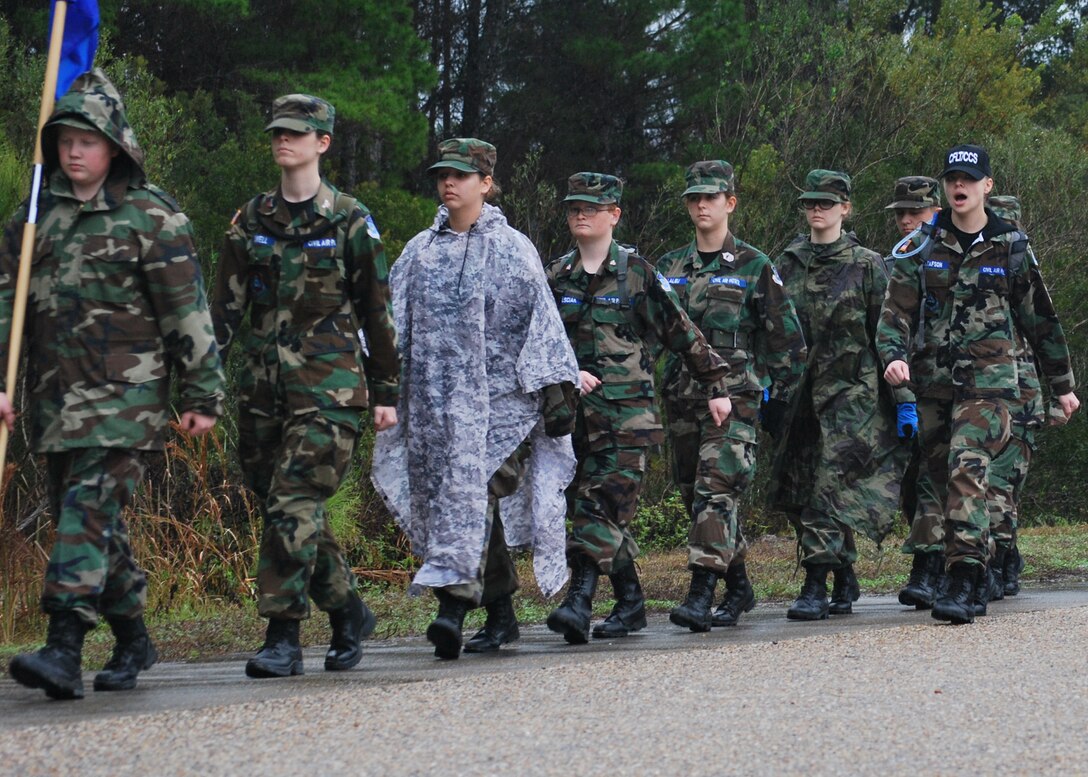 Civil Air Patrol cadets march in the rain Jan. 2, at Silver Flag on Tyndall. Cadets take part in an annual winter encampment training exercise where they learn military customs and courtesies and leadership skills. (U.S. Air Force photo by 2nd Lieutenant Christopher Bowyer-Meeder)