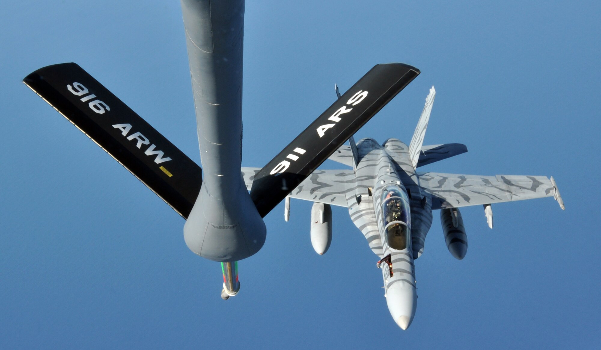 A KC-135R Stratotanker from the 916th Air Refueling Wing prepares to refuel a Marine F/A-18D Hornet during exercise Razor Talon on Dec. 13, 2013. The exercise is a recurring, monthly, large scale exercise flown over the mid-Atlantic coastline. (USAF photo by SSgt. Alan Abernethy, 916ARW/PA)