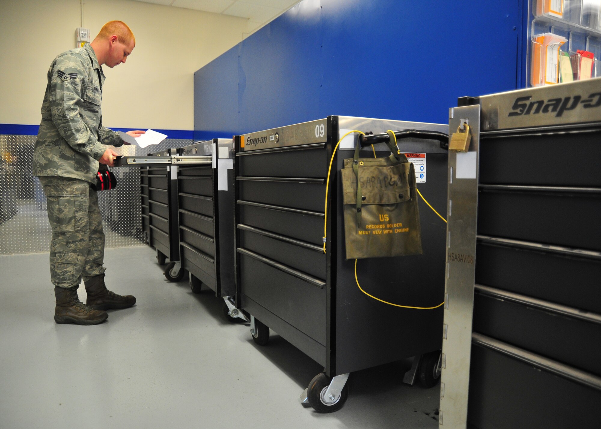 Senior Airman Jonathon Strait, 95th Aircraft Maintenance Unit weapons load team member, reviews a discrepancy log for one of several new weapons composite tool kits. The new tool kits are part of the incoming $65 million worth of equipment to support newly arriving jets. (U.S. Air Force photo by Airman 1st Class Dustin Mullen)