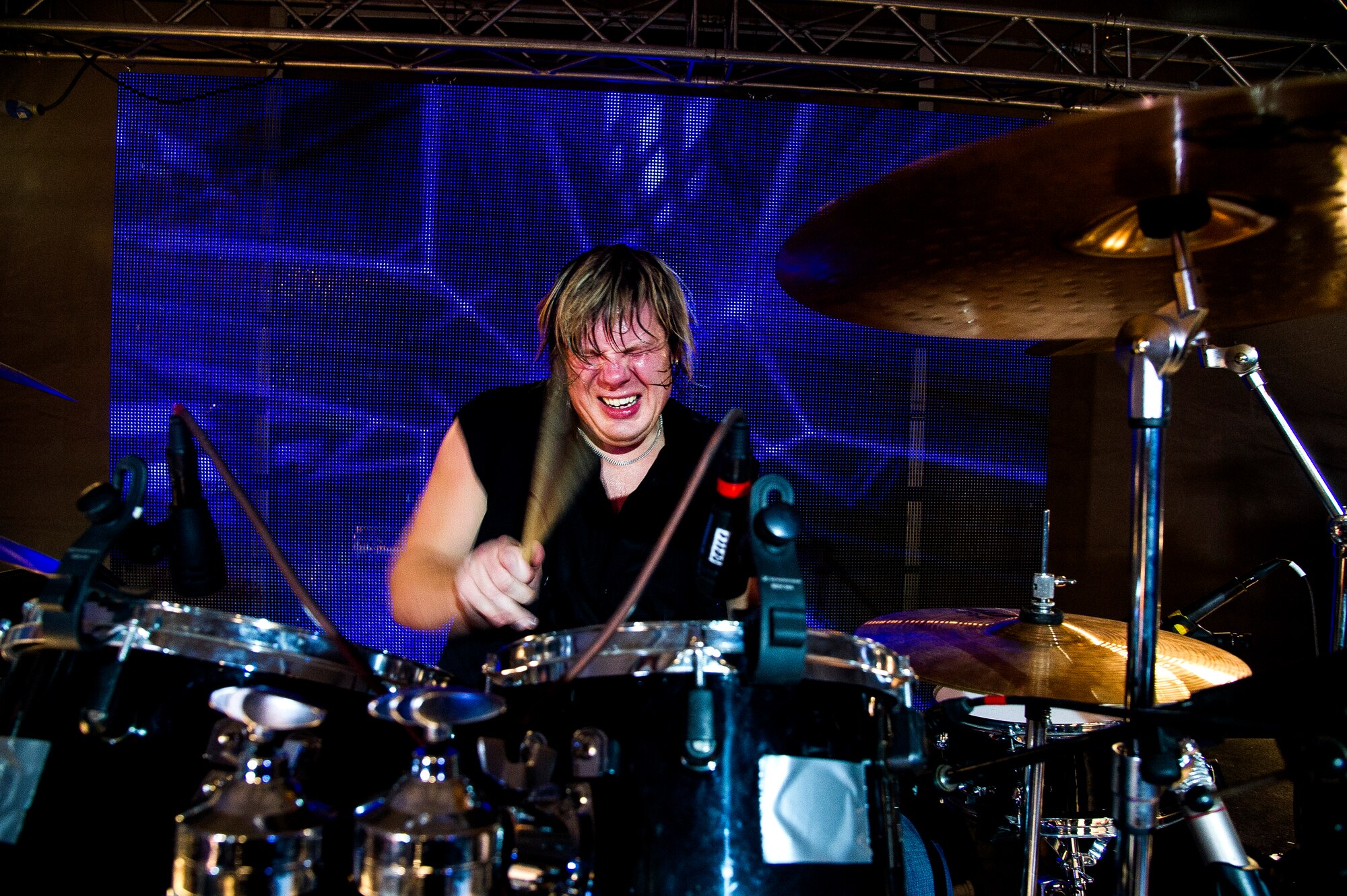 Pontus Engborg, drummer, performs a drum solo during a concert at Transit Center at Manas, Kyrgyzstan, Dec. 31, 2013. Bobby Kimball, Alex Ligertwood and Bill Champlin performed for members of TCM to celebrate the New Year. More than 1200 Service members and civilian counterparts attended the event. (U.S. Air Force photo/Senior Airman George Goslin)