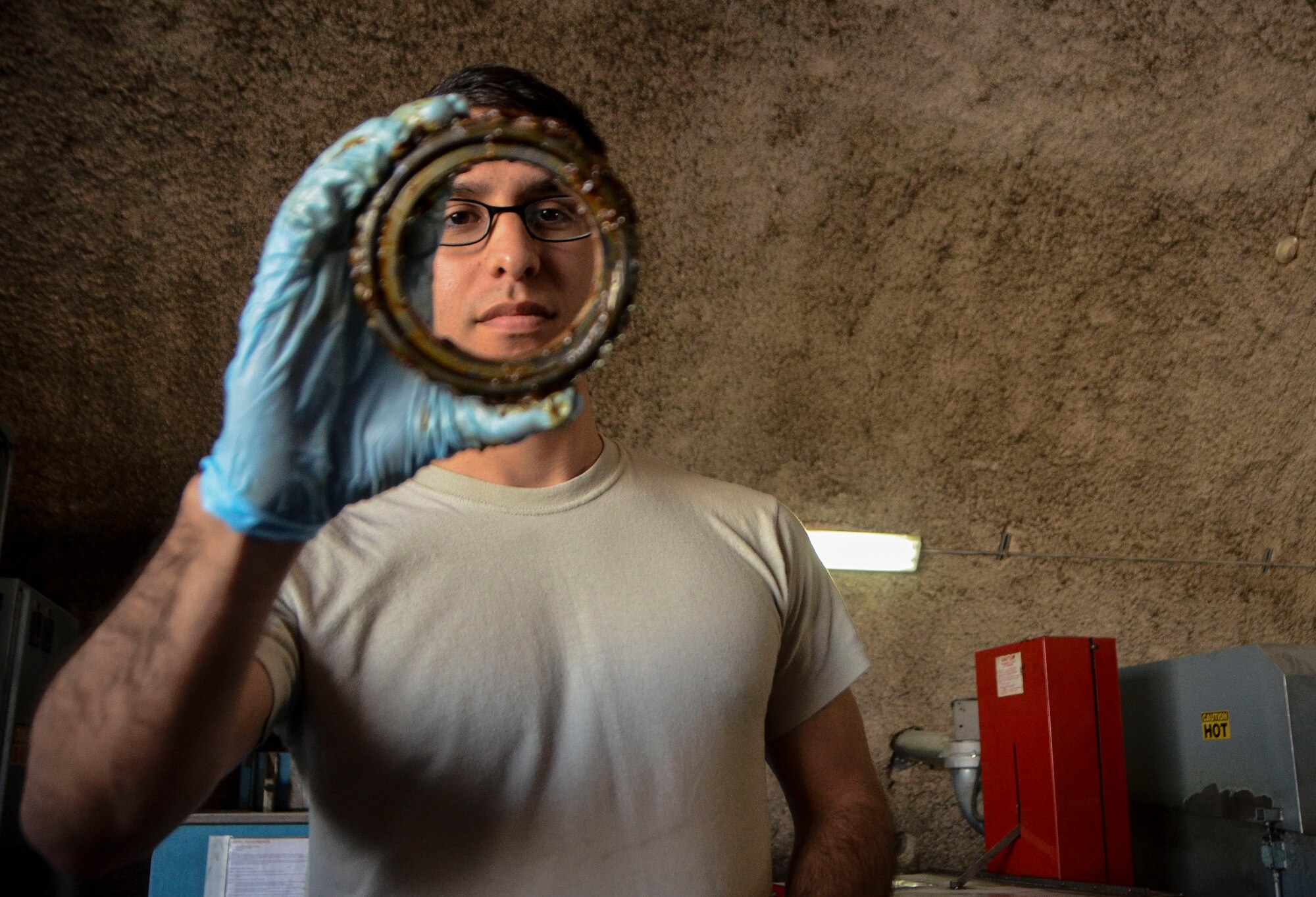 Airman 1st Class Michael Galvan inspects a wheel bearing of a C-130J Super Hercules at the 379th Air Expeditionary Wing, Dec. 31, 2013. Galvan is a 379th Expeditionary Maintenance Squadron wheel and tire technician and is part of an 8-man shop which fixes and maintains all aircraft wheels for the base. Galvan is deployed from Joint Base Pearl Harbor-Hickam, Hawaii, and is a Santa Ana, Calif. native. (U.S. Air Force photo/Senior Airman Jared Trimarchi)