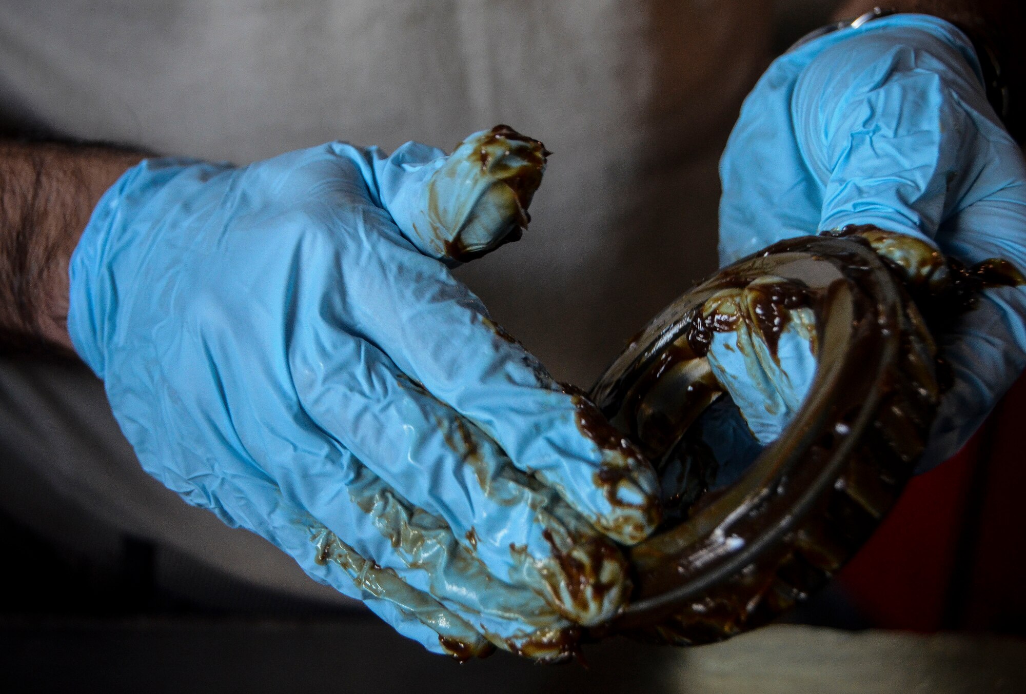 Airman 1st Class Michael Galvan greases a wheel bearing of a C-130J Super Hercules at the 379th Air Expeditionary Wing, Dec. 31, 2013. Galvan is a 379th Expeditionary Maintenance Squadron wheel and tire technician and is part of an 8-man shop which fixes and maintains all aircraft wheels for the base. Galvan is deployed from Joint Base Pearl Harbor-Hickam, Hawaii, and is a Santa Ana, Calif. native. (U.S. Air Force photo/Senior Airman Jared Trimarchi)