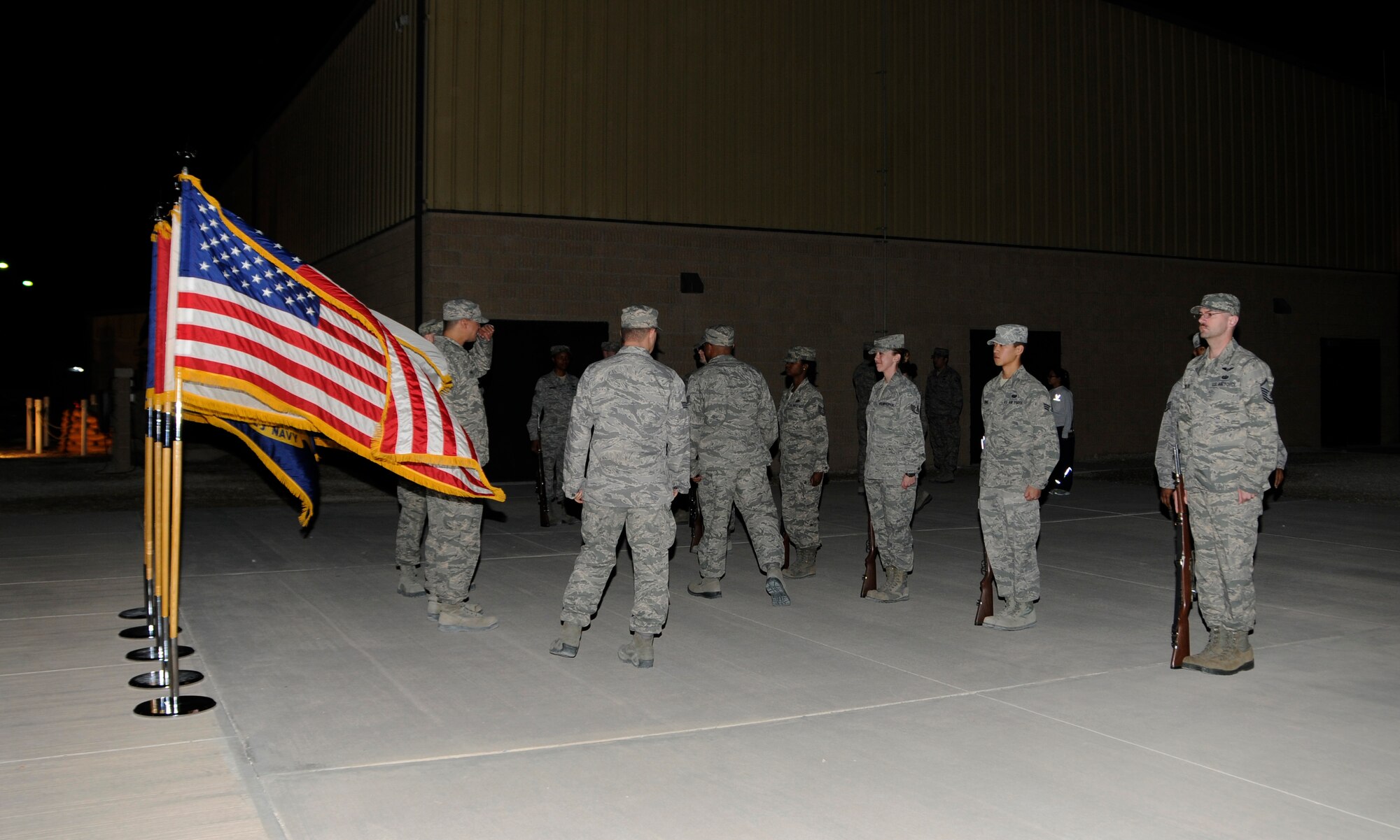 Members of the 379th Air Expeditionary Wing Honor Guard compete in a drill-off in Southwest Asia, Jan. 2, 2014. The Honor Guard holds drill-offs which consisted of rifle movements and commands to select who will participate in the next detail. The Honor Guard is made up of volunteer service members and practices two times a week to hone their skills. (U.S. Air Force photo/Senior Airman Hannah Landeros)