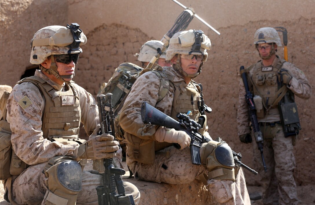 U.S. Marines take a break at the end of a patrol in Afghanistan's Helmand province, Dec. 29, 2013. 