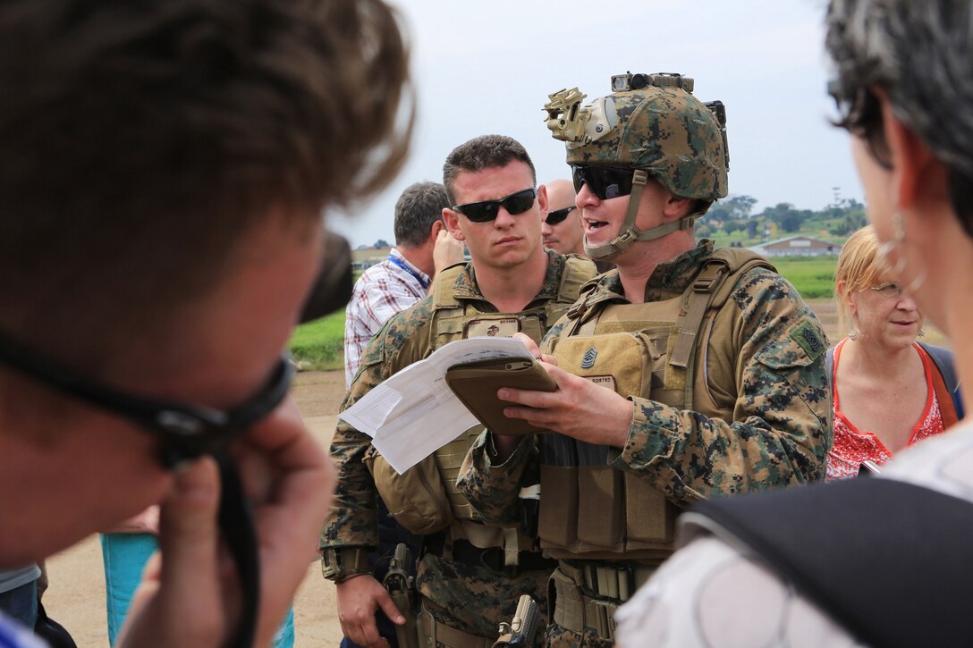 U.S. Marine Corps Master Sgt. Robert Gupton accounts for passengers on a manifest at Entebbe, Uganda, after safely evacuating them from the U.S. Embassy in Juba, South Sudan, Jan. 3, 2014. A squad-size element of U.S. Marines assigned to the Special-Purpose Marine Air-Ground Task Force Crisis Response successfully evacuated more than 20 people from the U.S. Embassy in coordination with the East Africa Response Force, and under the command and control of Combined Joint Task Force-Horn of Africa. Gupton is assigned to the Special-Purpose Marine Air-Ground Task Force Crisis Response.