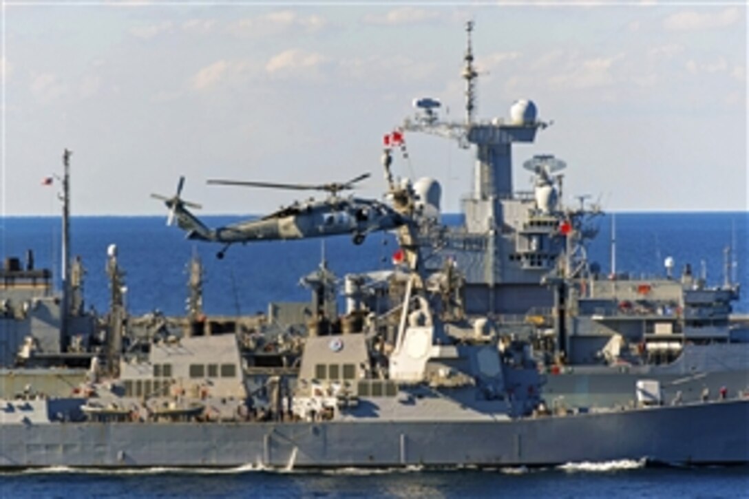 The USS Bulkeley, foreground, conducts an underway replenishment with the USNS Arctic in the Gulf of Oman, Dec. 29, 2013. The Bulkeley is part of the Harry S. Truman Carrier Strike Group supporting maritime security operations and theater security cooperation efforts in the U.S. 5th Fleet area of responsibility. 