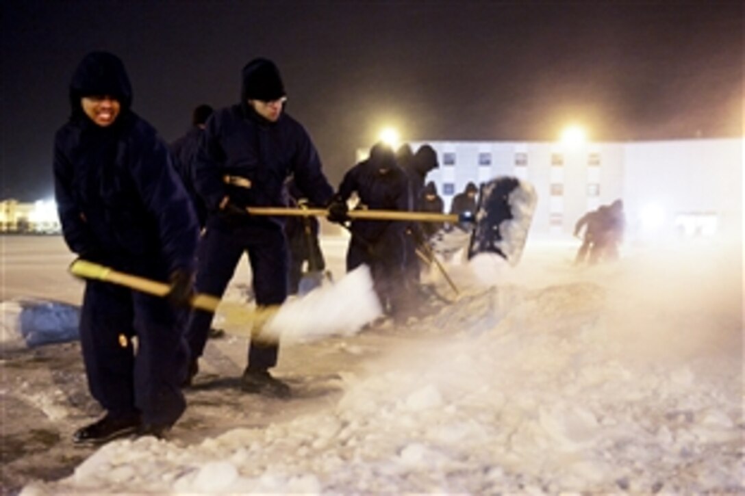 U.S. Coast Guard recruits clear a path to continue training in the 18-degree temperatures and gusty winds at Training Center Cape May, N.J., Jan. 3, 2013. More than half of the recruits assigned to Echo Company 189 have never shoveled snow before. The Coast Guard uses Cape May as its basic training facility because of its diverse weather conditions. 