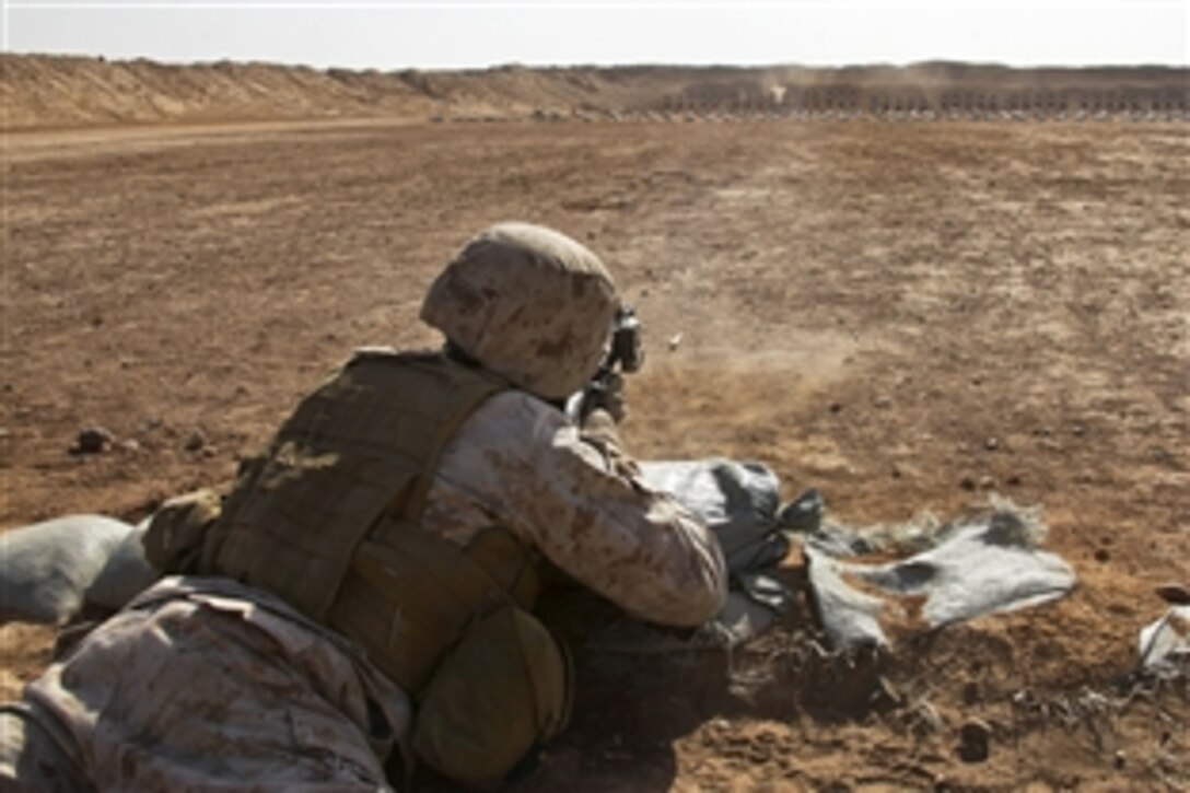 U.S. Marine Corps Sgt. Dominique Young fires at a target to acquire a battle sight zero on Camp Leatherneck in Helmand province, Afghanistan, Dec. 22, 2013. Young, an intelligence specialist, is assigned to Headquarters and Service Company, 3rd Battalion, 7th Marine Regiment.