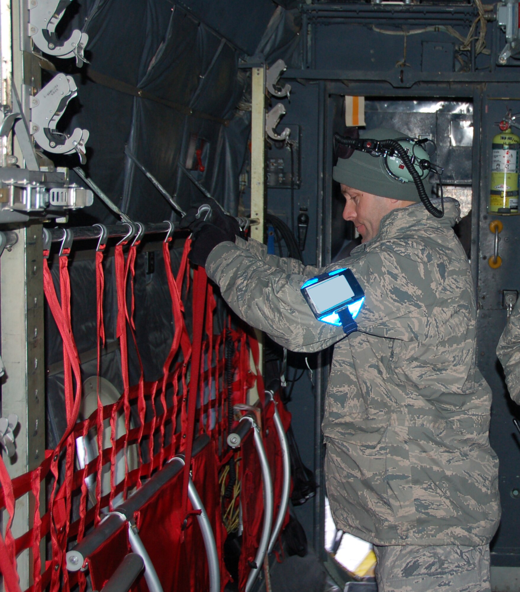 Technical Sgt. Ernest Descheneaux, a crew chief assigned to the 103rd Maintenance Group, completes pre-flight preparations before the first locally-generated sortie aboard a C-130H Hercules aircraft Dec. 19, 2013, at Bradley Air National Guard Base, East Granby, Conn.  The aircrew was comprised of Airmen from the Connecticut Air National Guard, the New York Air National Guard and the U.S.A.F.  (U.S. Air National Guard photo by Maj. Bryon Turner)