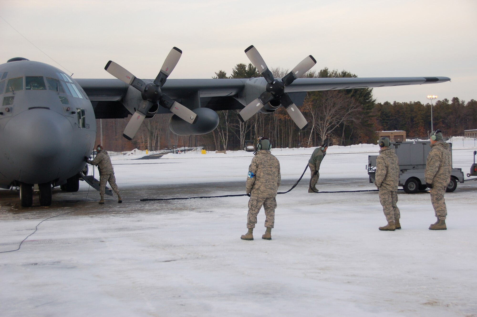Members of the 103rd Maintenance Group complete pre-flight preparations before the first locally-generated sortie for a C-130H Hercules Dec. 19, 2013, at Bradley Air National Guard Base, East Granby, Conn.  The aircrew was comprised of Airmen from the Connecticut Air National Guard, the New York Air National Guard and the U.S.A.F.  (U.S. Air National Guard photo by Maj. Bryon Turner)