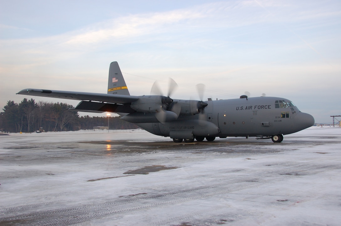 Aircrew aboard a C-130H Hercules aircraft assigned to the 103rd Airlift Wing prepare to taxi moments before conducting the first locally-generated sortie with the unit’s new airframe at Bradley Air National Guard Base, East Granby, Conn., Dec. 19, 2013.  (U.S. Air National Guard photo by Maj. Bryon Turner)