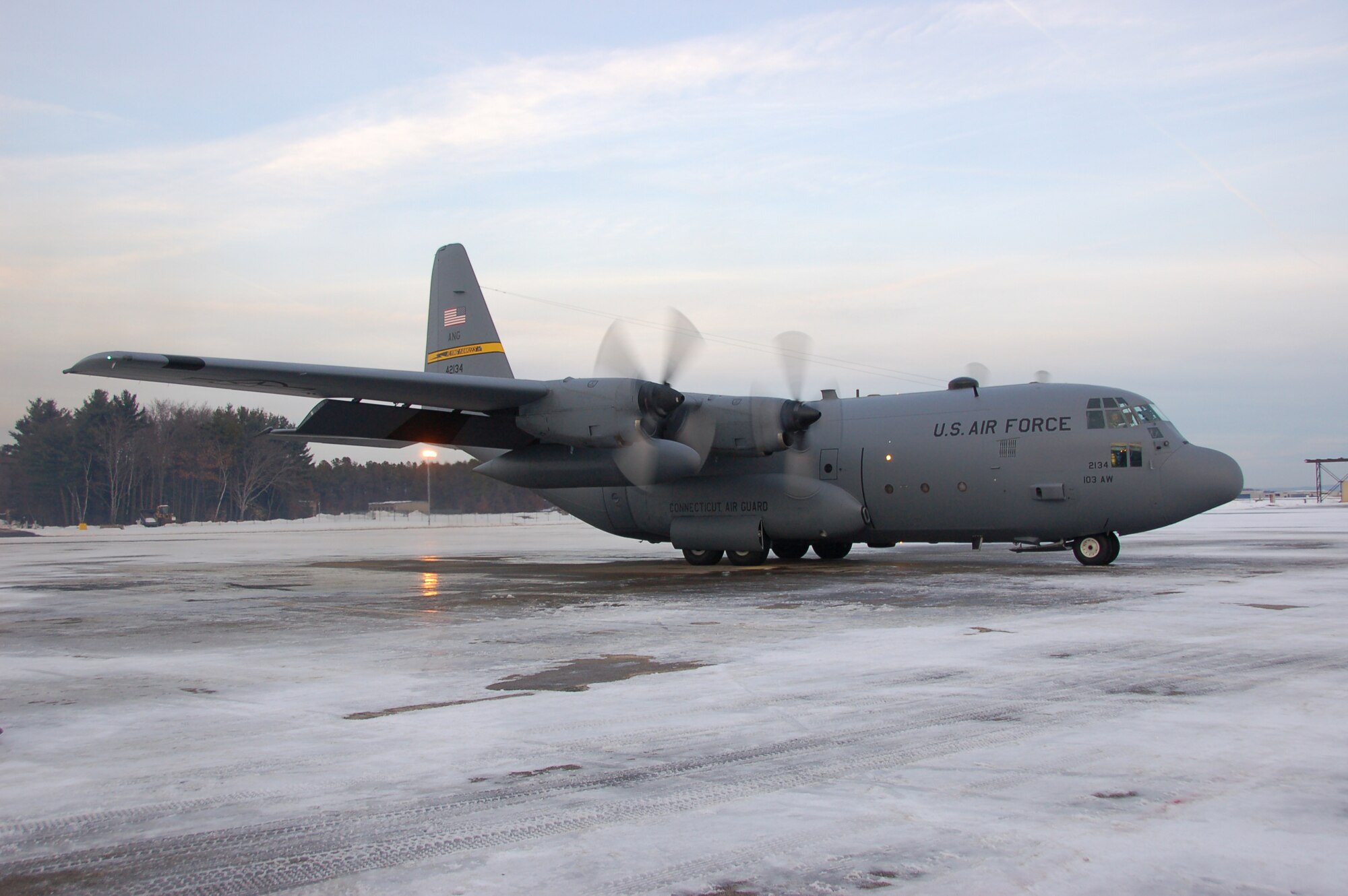 Aircrew aboard a C-130H Hercules aircraft assigned to the 103rd Airlift Wing prepare to taxi moments before conducting the first locally-generated sortie with the unit’s new airframe at Bradley Air National Guard Base, East Granby, Conn., Dec. 19, 2013.  (U.S. Air National Guard photo by Maj. Bryon Turner)