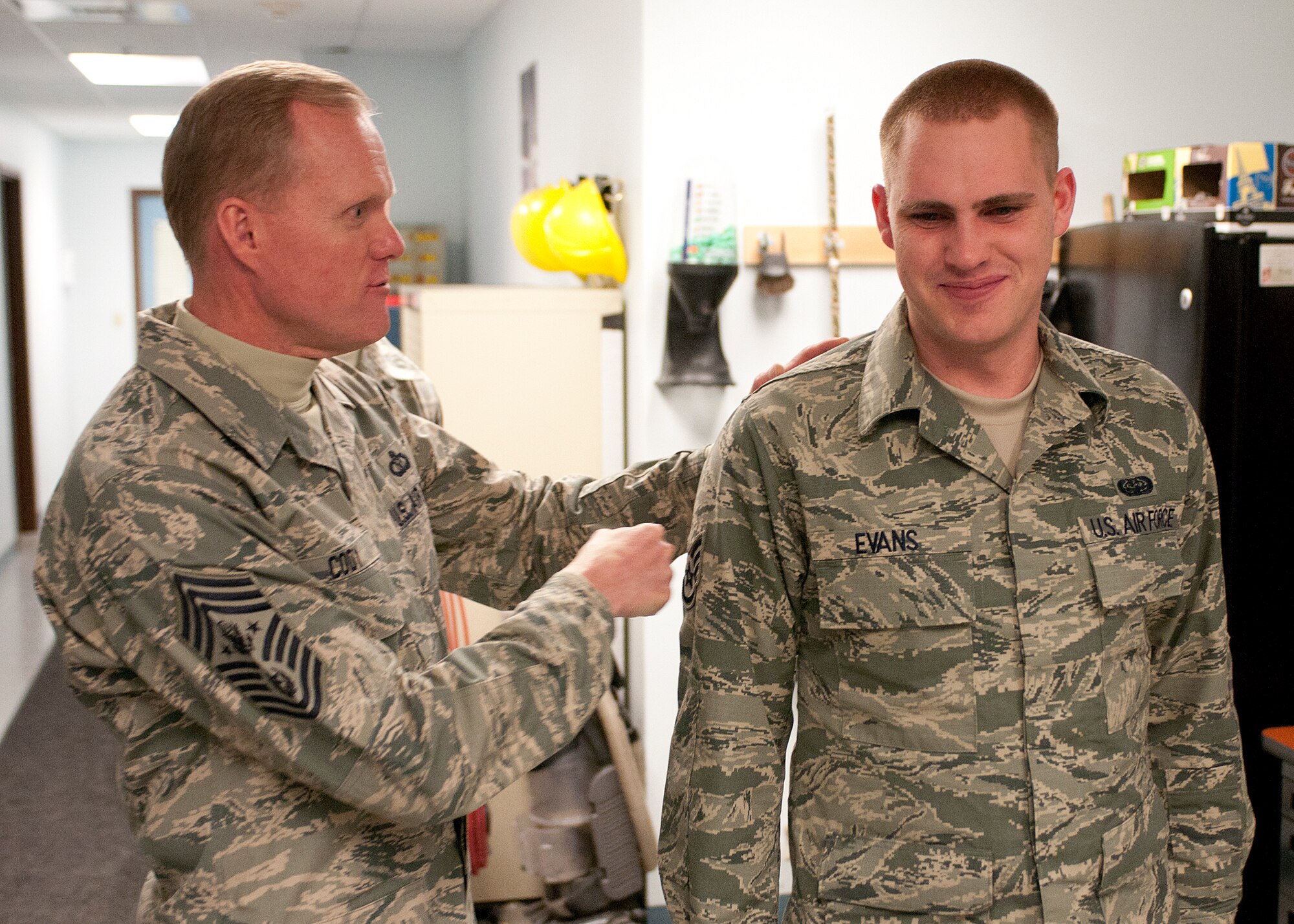 PEASE AIR NATIONAL GUARD BASE, N.H. -- Chief Master Sgt. of the Air Force James A. Cody congratulates Staff Sgt. Justin Evans, 157th Communications Flight Knowledge Operations manager, Jan. 4. Evans was promoted earlier at the flight’s morning roll call. The Air Force's most senior enlisted member visited with Airmen from the 157th Medical Group, 157th Mission Support group, 157th Operations Group and 157th Maintenance Group during his visit to Pease ANG Base. (N.H. Air National Guard photo by Tech. Sgt. Mark Wyatt/Released)