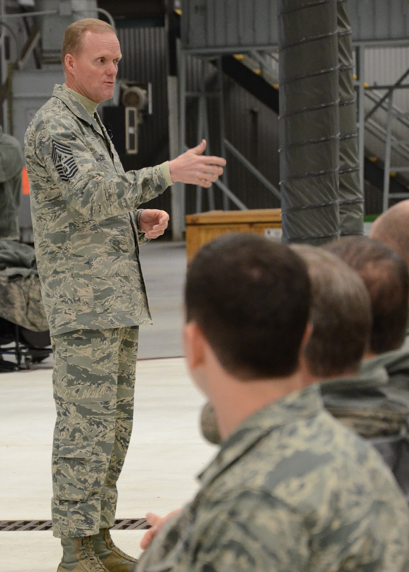 PEASE AIR NATIONAL GUARD BASE, N.H. -- Chief Master Sgt. of the Air Force James Cody addresses airmen Jan. 4, 2014, on Pease Air National Guard Base during an all-call session. Chief Cody opened the session with brief remarks then fielded several questions concerning enlisted members across the Air Force and Air National Guard. The Air Force's most senior enlisted member visited Pease ANGB to speak with enlisted Airmen and observe the unique capability they provide to the state of New Hampshire and the Air Force. (N.H. National Guard photo by Airman 1st Class Kayla M. McWalter/Released)