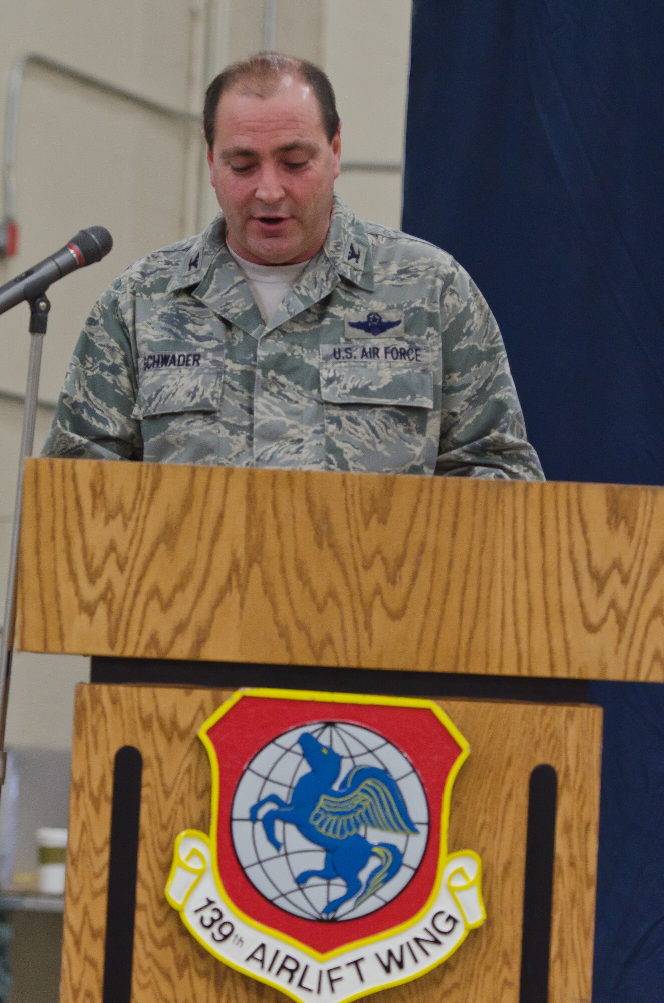 Col. Ralph Schwader, 139th Airlift Wing commander, speaks to members of the Wing after receiving command of the Wing on Jan. 5, 2014 at Rosecrans Air National Guard Base, St. Joseph, Mo.  (U.S. Air  National Guard photo by Senior Airman Sheldon Thompson)
