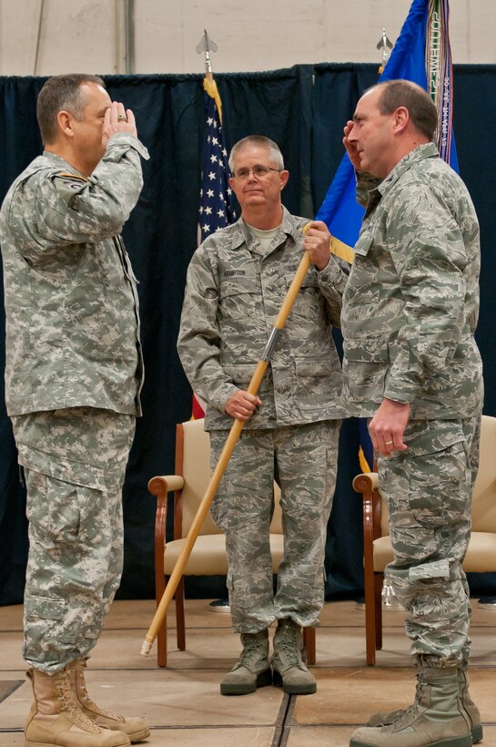 Col. Ralph Schwader, (right) 139th Airlift Wing commander, salutes Maj. Gen. Stephen Danner, Missouri National Guard adjutant general, after receiving command of the Wing on Jan. 5, 2014 at Rosecrans Air National Guard Base, St. Joseph, Mo. (U.S. Air  National Guard photo by Senior Airman Sheldon Thompson)