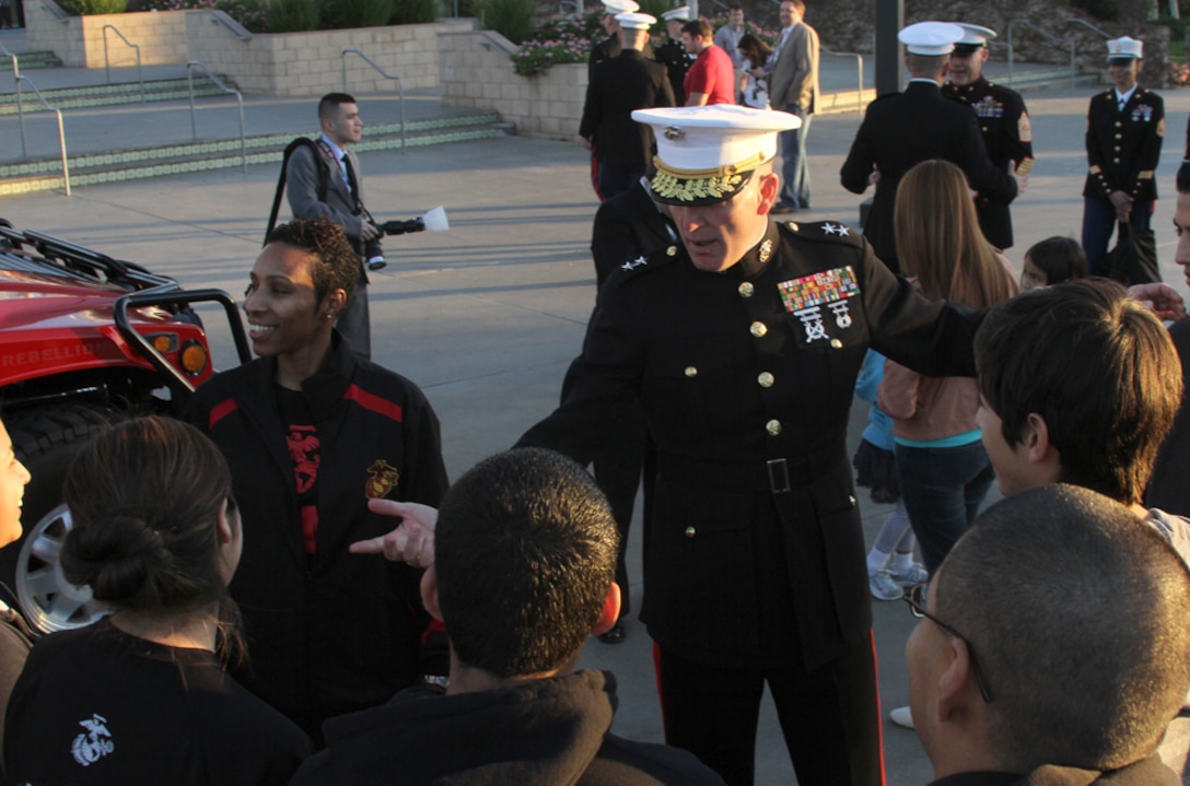 CARSON, Calif. - Major Gen. Mark Brilakis, the commanding general of Marine Corps Recruiting Command, speaks to Semper Fidelis All-American Bowl attendees during the fan fest before the Semper Fidelis All-American Bowl at The StubHub Center in Carson, Calif., Jan. 5, 2014. Local Marines from the reserve center and recruiting district set up vehicles and booths for the bowl attendees to learn more about the Marine Corps and be entertained before the start of the game. The Semper Fidelis Football Program brought together over 90 of the best high-school football players in an East versus West game and is an opportunity for the Marine Corps to connect on a personal and local level with players and influencers, demonstrates commitment to developing quality citizens, and reinforces how core values of honor, courage and commitment relate to success on and off the field. (Official U.S. Marine Corps photo by Sgt. Dwight A. Henderson/Released)