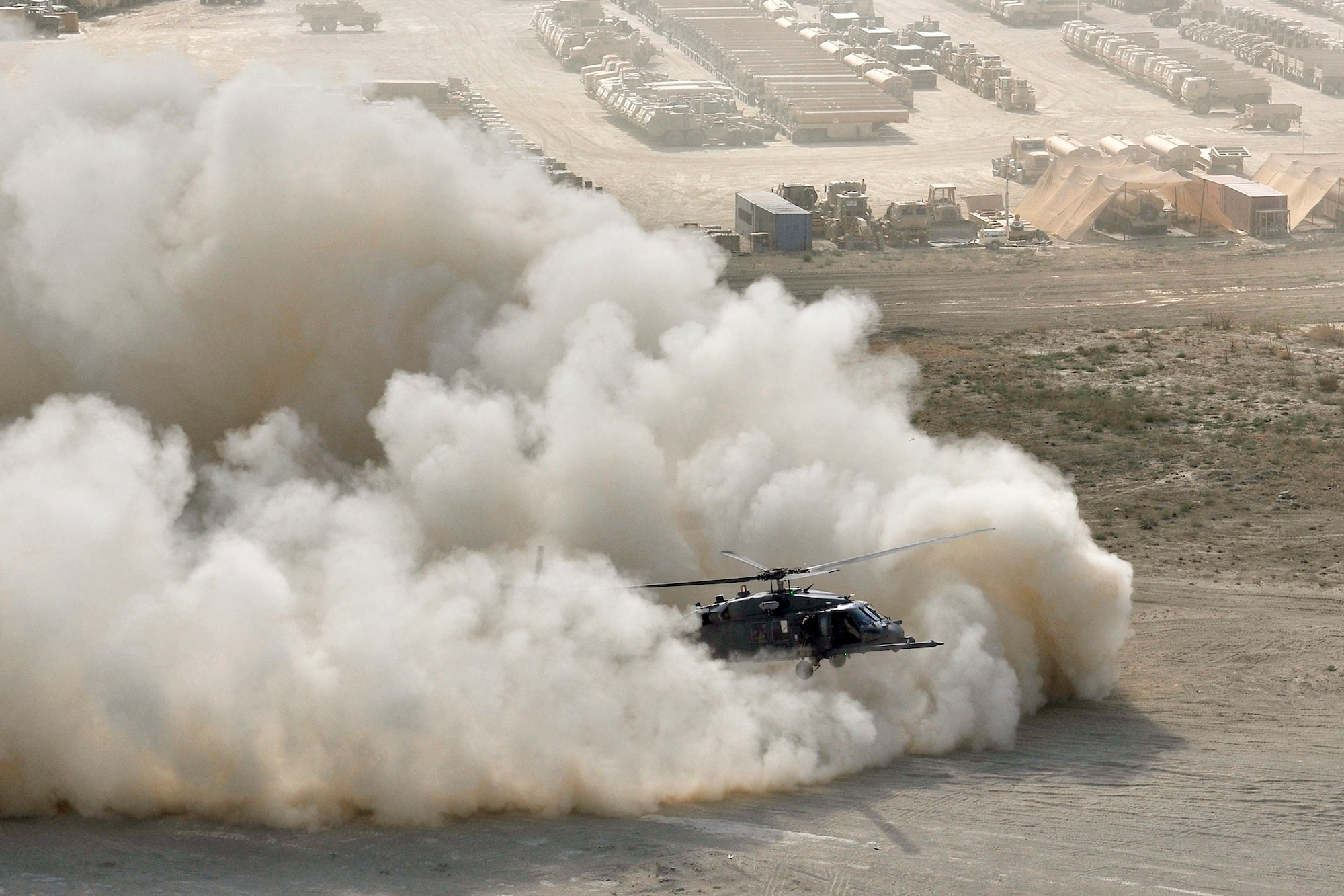 An HH-60G Pave Hawk helicopter assigned to the 33rd Expeditionary Rescue Squadron performs a brown out landing Sept. 24, 2010, at Bagram Airfield, Afghanistan. (U.S. Air Force photo/Staff Sgt. Christopher Boitz)