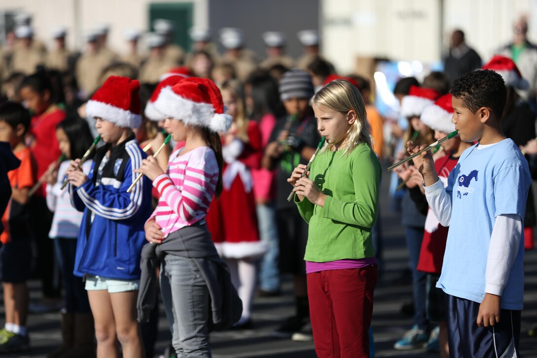 Students from Carillo Elementary School perform in different musical acts for Marines from Marine Aircraft Group 39 stationed at Marine Corps Base Camp Pendleton, Calif., Dec. 20. The elementary school donated food, toys, clothing and other lightly used good for Marines and their families in need.


