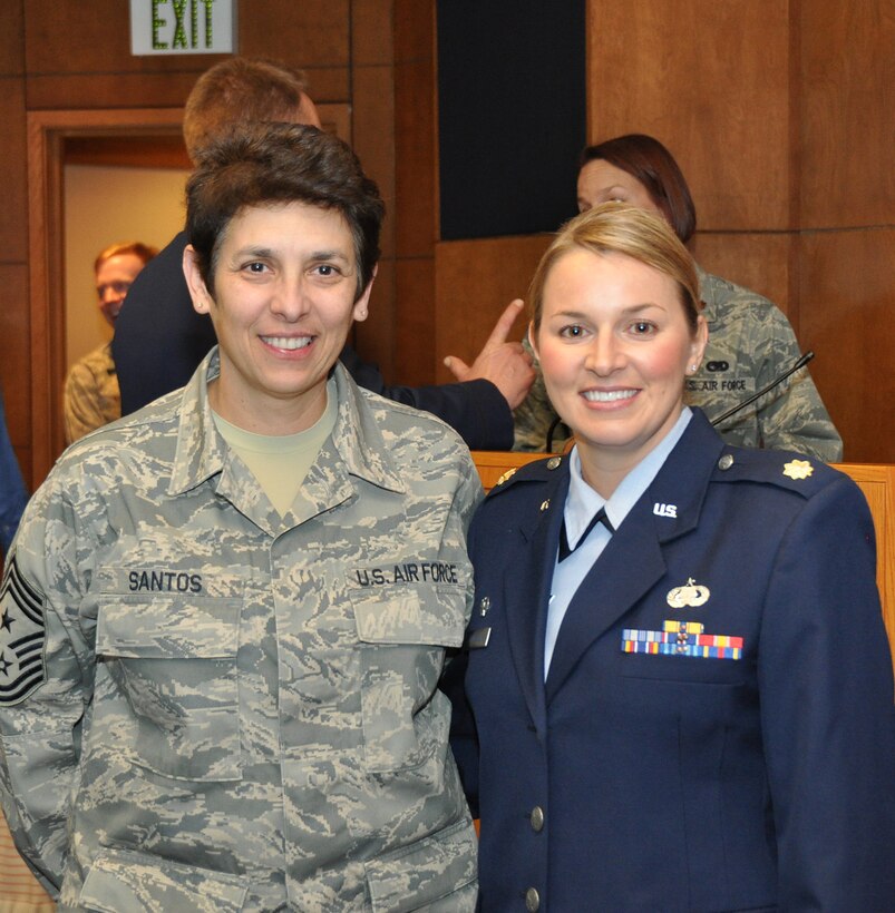 TRAVIS AIR FORCE BASE, Calif. -- Maj Erin Floersch receives the 349th Memorial Affairs Squadron guidon during an assumption of command ceremony officiated by Col. Stuart Toft, 349th Mission Support Group commander, Jan. 5.   Floersch officially took command of the squadron Nov. 2, 2013. (U.S. Air Force photo/Senior Master Sgt. Robert Wade)