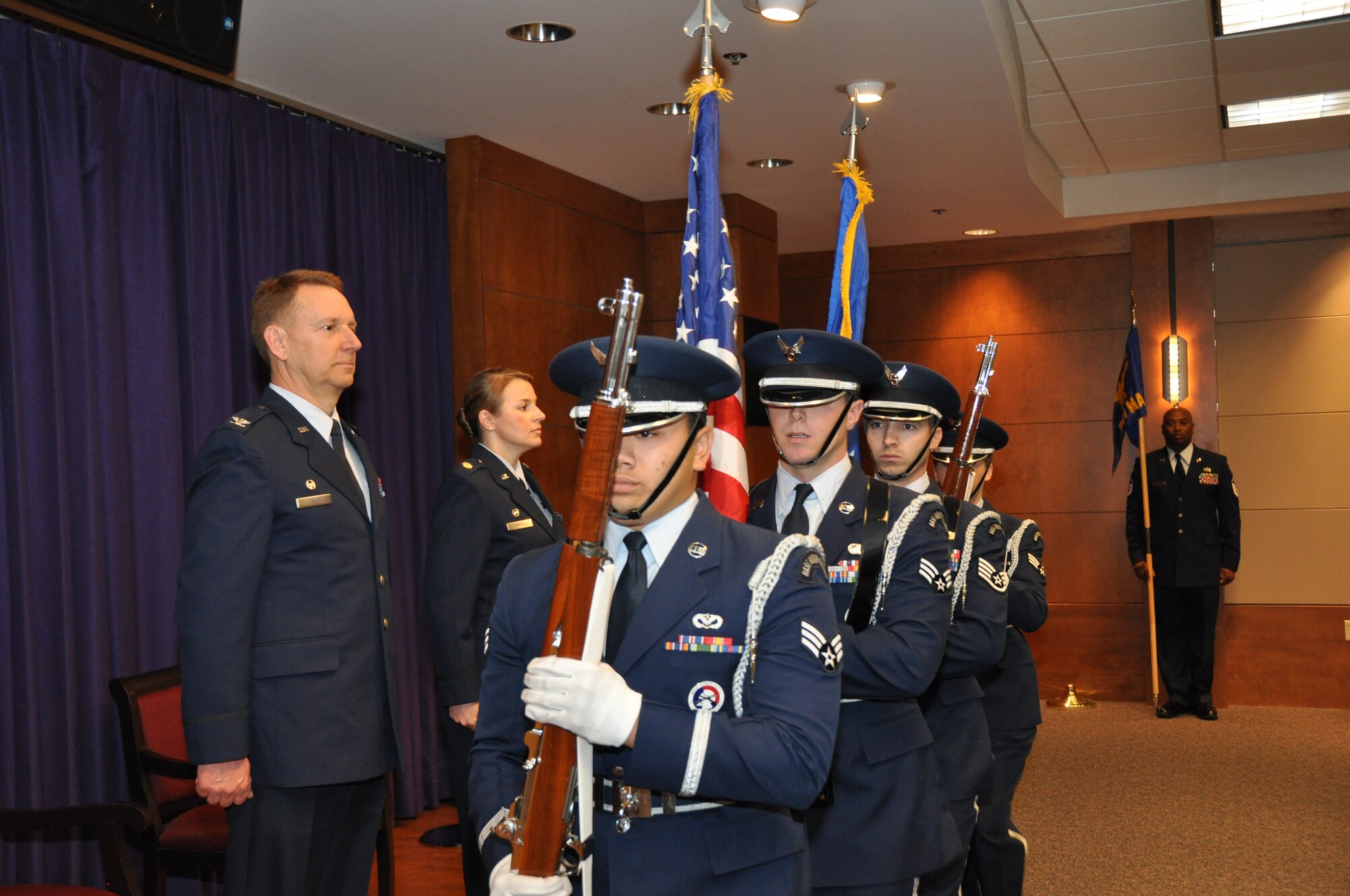 TRAVIS AIR FORCE BASE, Calif. -- Maj Erin Floersch receives the 349th Memorial Affairs Squadron guidon during an assumption of command ceremony officiated by Col. Stuart Toft, 349th Mission Support Group commander, Jan. 5.   Floersch officially took command of the squadron Nov. 2, 2013.