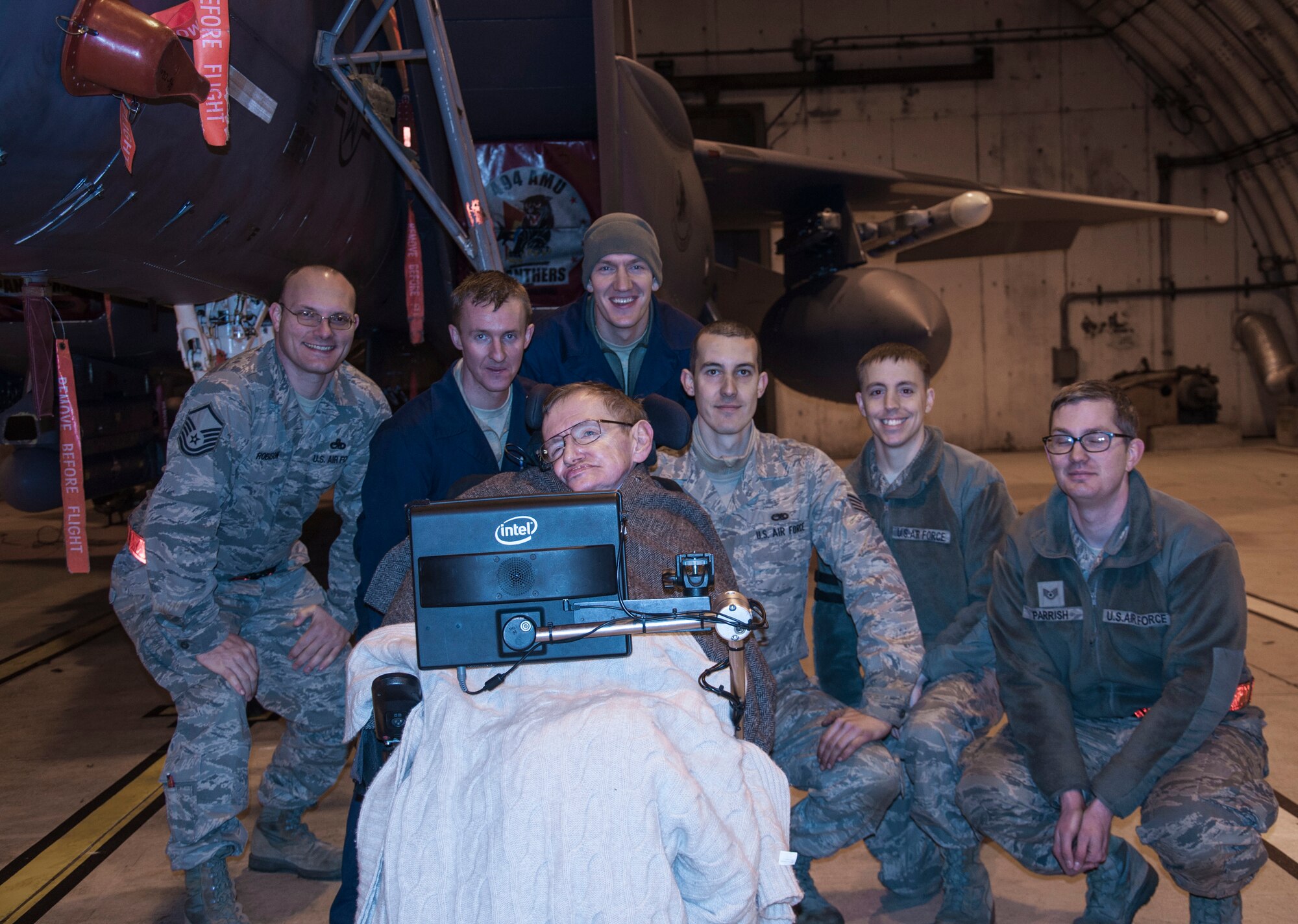 Members of the 48th Aircraft Maintenance Squadron, welcome Professor Stephen Hawking, University of Cambridge professor and best-selling author, to Royal Air Force Lakenheath, England, Dec. 29, 2013. From left to right: Master Sgt. Patrick Robison, Staff Sgt. Benjamin Vass, Staff Sgt. Joshua Angus, Staff Sgt. Greggory Swarz, Tech. Sgt. Christopher Palmer and Staff Sgt. Blake Parrish. Hawking stopped by the base for an impromptu visit. Despite the late notice, Master Sgt. Patrick Robison, 48th AMXS maintenance debrief NCO in charge, said his “maintainers did an exceptional job representing the Liberty Wing and the U.S. Air Force. (Courtesy photo by RAF Sqn. Ldr. Jerry Neild)