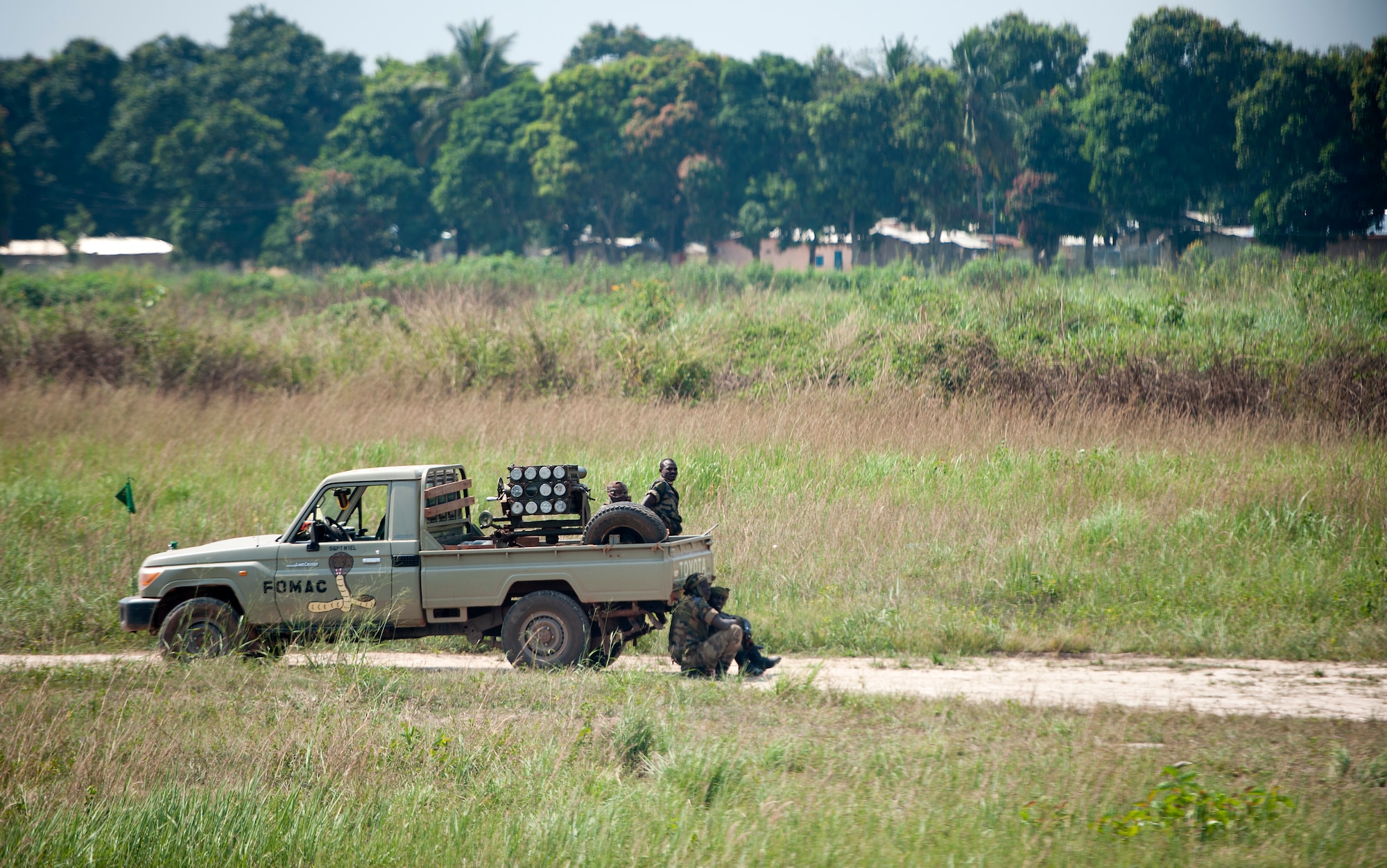 Members of the Multinational Force of Central Africa guard an airfield while U.S. and international forces deliver supplies to displaced civilians Dec. 20, 2013. Airmen of the 37th Airlift Squadron, assigned to Ramstein Air Base, Germany delivered much-needed supplies and personnel to Central African Republic, Africa, as part of an international peace-keeping mission providing support to the civilian population disrupted by the nation’s recent conflicts. (U.S. Air Force photo/Senior Airman Damon Kasberg)