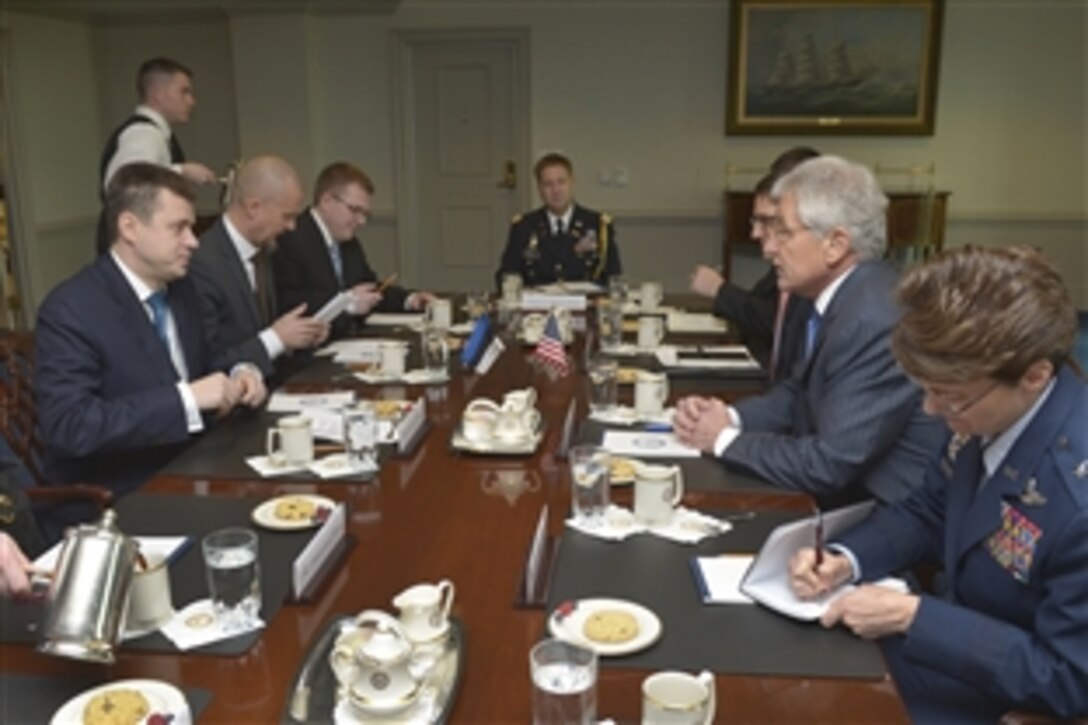 U.S. Defense Secretary Chuck Hagel, second right, meets with Estonia's Defense Minister Urmas Reinsalu, first left, at the Pentagon, Jan. 6, 2014. Hagel praised Estonia's steadfast commitment to security in Afghanistan, to include supporting stability in Afghanistan post-2014.