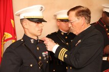 2nd Lt. Robin Shuberg is pinned by his father, retired Cmdr. Richard Shuberg, during a commissioning ceremony, Jan 3. Shuberg, a Chippewa Lake, Mich. native, served as an enlisted Marine before leaving the service to pursue a bachelor’s degree in Recreational Leadership Management through Ferris State University. While earning his degree, Shuberg participated in the Platoon Leaders Class (PLC) to earn his commission. For more information on the PLC Program visit Marines.com