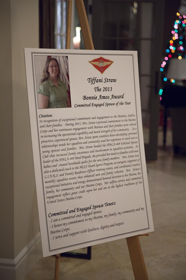 A poster displayed announces the Committed and Engaged Spouse of the Year and recipient of the first Bonnie Amos Award at a holiday party aboard Marine Corps Air Station Miramar, Calif., Dec. 6. Major General Steven Busby, commanding general of 3rd Marine Aircraft Wing (MAW), hosted the party to bring people together to recognize committed and engaged spouses and leaders.


