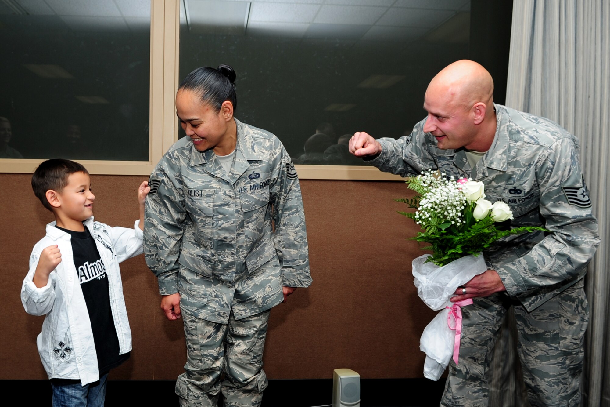 U.S. Air Force Staff Sgt. Darlene Rust, 633rd Force Support Squadron noncommissioned officer in charge of personnel assistance, was promoted to the rank of technical sergeant through the Stripes for Exceptional Performers program at Langley Air Force Base, Va., Dec. 20, 2013. The STEP program is designed to promote NCOs who demonstrate outstanding performance.  Rust’s son Ethan and husband, Tech. Sgt. Nathan Rust, 633rd Logistics Readiness Squadron air terminal supervisor, were in attendance to show their support. Darlene hails from Dededo, Guam, and Nathan’s hometown is Kenneth, Minn. (U.S. Air Force photo by Airman 1st Class Areca T. Wilson/Released)