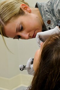 U.S. Air Force Maj. Melissa Fisher, 633rd Medical Group oral and maxillofacial surgeon, performs filler injections during a cosmetic surgery at Langley Air Force Base, Va., Jan. 2, 2014. Maxillofacial surgeons are able to perform many different surgeries focusing on the face and neck such as oral surgery, corrective jaw surgery, obstructive sleep apnea surgery, bone grafting, repair of complex lacerations of the head and neck, and soft-tissue biopsies of the face. Fisher is a native of Decatur, Ill. (U.S. Air Force photo by Staff Sgt. Wesley Farnsworth/Released)