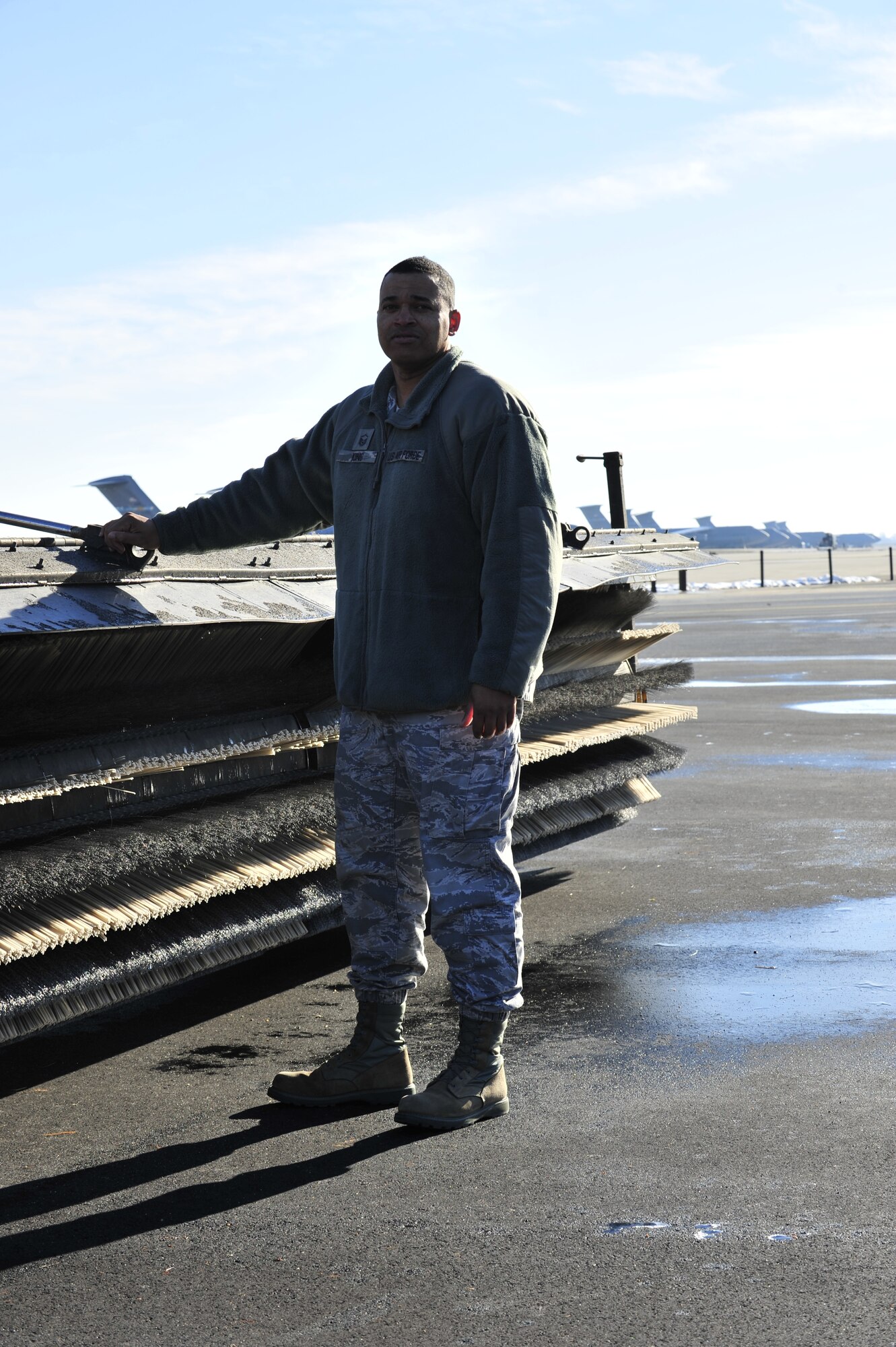 Master Sgt. Dennis King, 436th Civil Engineer Squadron heavy repair superintendent, stands by a Oshkosh snow broom Dec. 11, 2013, at Dover Air Force Base, Del. King received the Society of American Military Engineers Goddard Medal for his outstanding contributions to military engineering in military troop construction, base maintenance and contingency engineering. (U.S. Air Force photo/Airman 1st Class William Johnson)