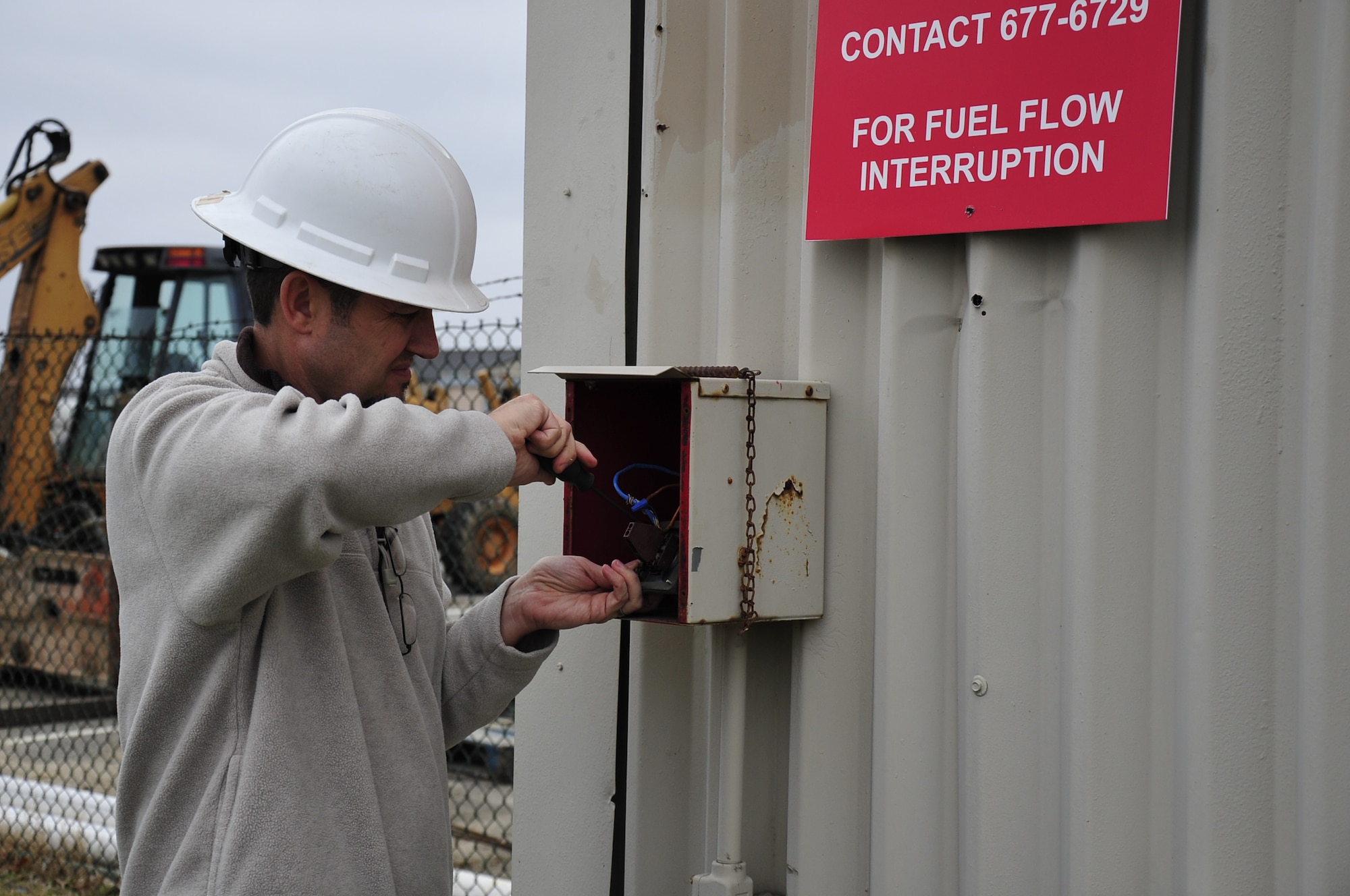 Richard Suwolitch, 436th Civil Engineer Squadron water and fuel system maintenance foreman, disconnects the fuel system’s emergency stop switch for maintenance Dec. 5, 2013, at Dover Air Force Base, Del. Suwolitch received the Air Mobility Command Outstanding Civil Engineer Civilian Manager Award and will go on to compete at the Air Force level. (U.S. Air Force photo/Airman 1st Class William Johnson)