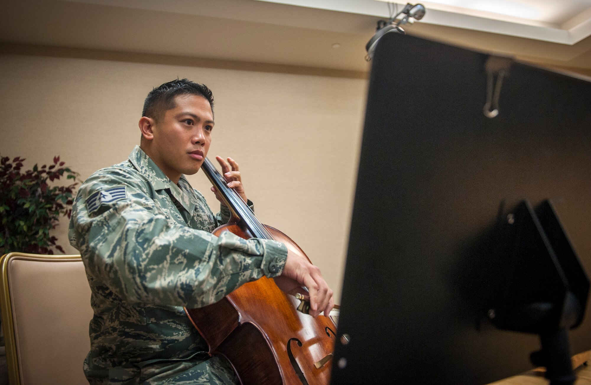 U.S. Air Force Staff Sgt. Joey Lee, 23d Aerospace Medicine Squadron public health technician, plays the national anthem on his cello at Moody Air Force Base, Ga., Sept. 6, 2013. Lee started playing the cello when he was 9. (U.S. Air Force photo by Senior Airman Jarrod Grammel/Released)
