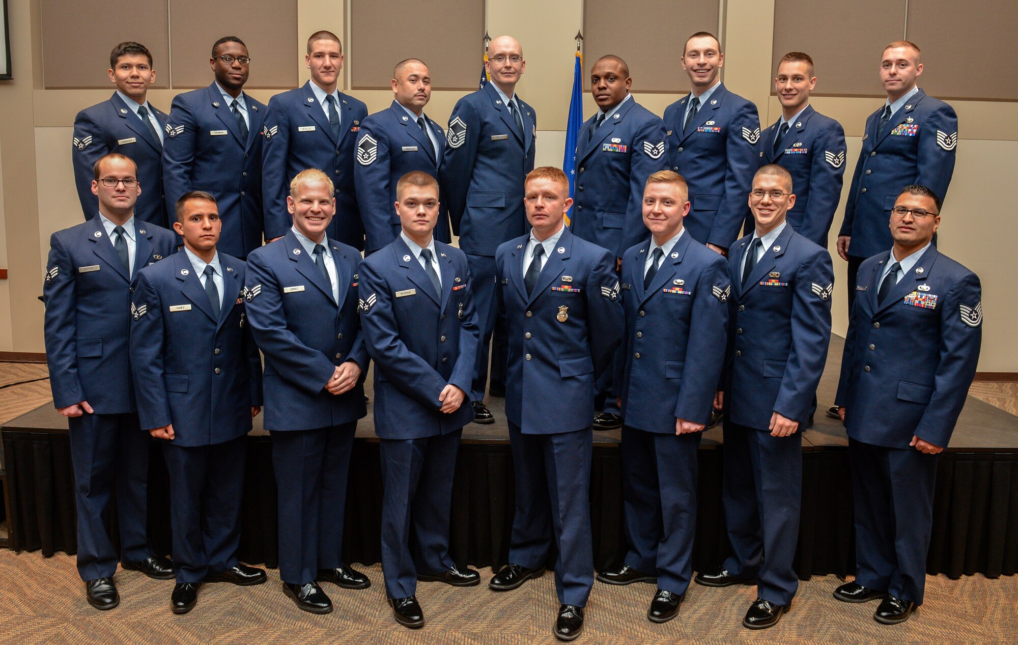 Seventeen Team Buckley members were promoted to the next rank Jan. 6, 2014, at the Leadership Development Center at Buckley Air Force Base, Colo. A promotion ceremony is a time-honored tradition in the Air Force, allowing co-workers, family and friends to support and congratulate Airmen on their promotion. (U.S. Air Force photo by Senior Airman Riley Johnson/Released)