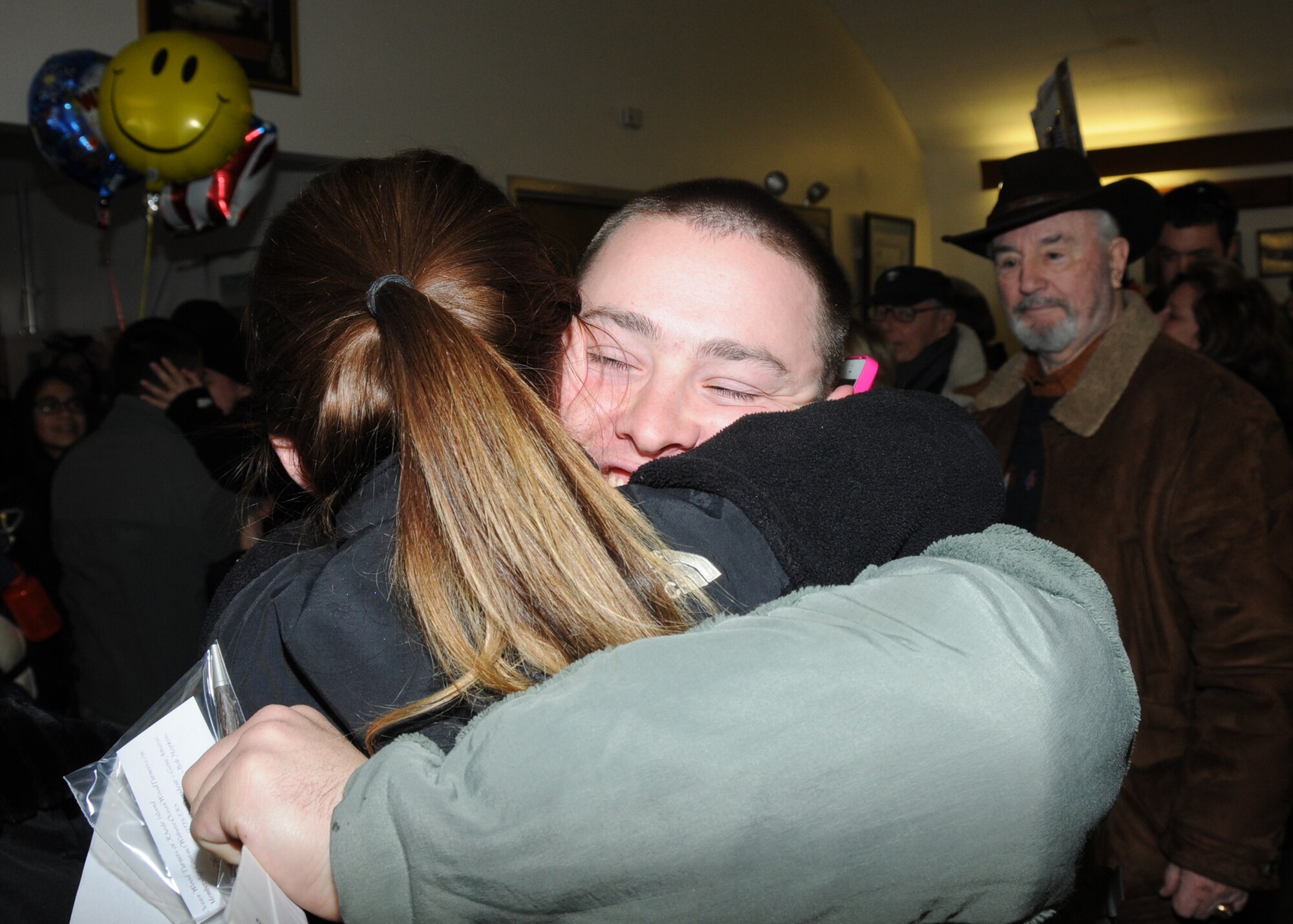 Excited families and friends greet their loved ones upon return from a deployment to Kuwait. Airmen from the 143d Airlift Wing Operations Group, Maintenance Group and Logistics Readiness Squadron were deployed in support of Operation Enduring Freedom. National Guard Photo by Master Sgt John McDonald (RELEASED)