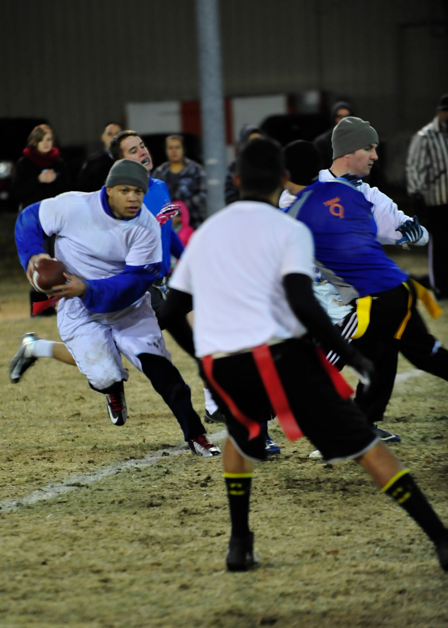 Antwan Piper, 436th Force Support Squadron/Comptroller Squadron running back, runs for a first down during the flag football championship Dec. 18, 2013, at Dover Air Force Base, Del. The 436th FSS/CPTS fell short 28-20 to the 9th Airlift Squadron. (U.S. Air Force photo/Airman First Class William Johnson)
