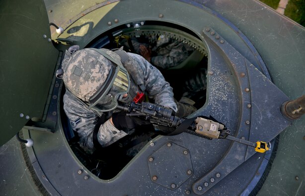 Airman 1st Class Christopher Mullis, 355th Security Forces Squadron creek defender course trainee, takes a defensive position in a HUMVEE turret during airfield defense training, Oct. 22, 2013, Baumholder, Germany. Mullis was part of a 98-student class undergoing training to prepare them for deployed conditions around the world. (U.S. Air Force photo/Airman 1st Class Jordan Castelan)