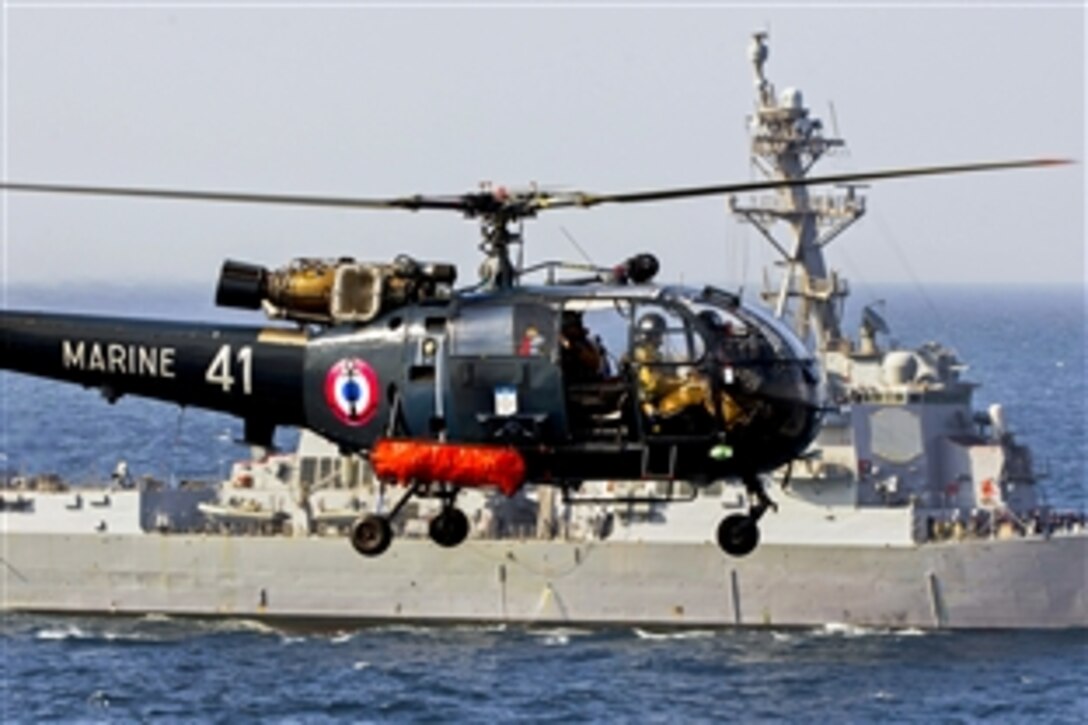 An Alouette III helicopter hovers near the guided-missile destroyer USS Bulkeley in the Gulf of Oman, Jan. 2, 2014. The Bulkeley, part of the Harry S. Truman Carrier Strike Group, is conducting operations with ships assigned to French Task Force 473 to enhance cooperation and maritime capabilities, and promote long-term regional stability in the U.S. 5th Fleet area of responsibility. 