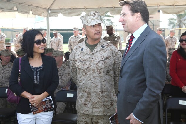 Newly appointed U.S. Marine Corps Forces Central Command (Forward) sergeant major, Sgt. Maj. Mario A. Marquez and his wife, Yasuko, talk with the British ambassador to the Kingdom of Bahrain, Amb. Iain Lindsey, prior to the Relief and Appointment Ceremony, Feb 12.