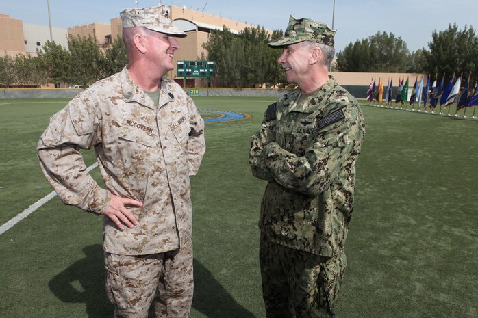 Former U.S. Marine Corps Forces Central Command (Forward) sergeant major, Sgt. Maj. John J. McGovern, talks with Rear Adm. William Lescher, commander, Expeditionary Strike Group Five, U.S. Naval Forces Central Command, after relinquishing his duties as MARCENT (Fwd) sergeant major to Sgt. Maj. Mario A. Marquez, Feb. 12.