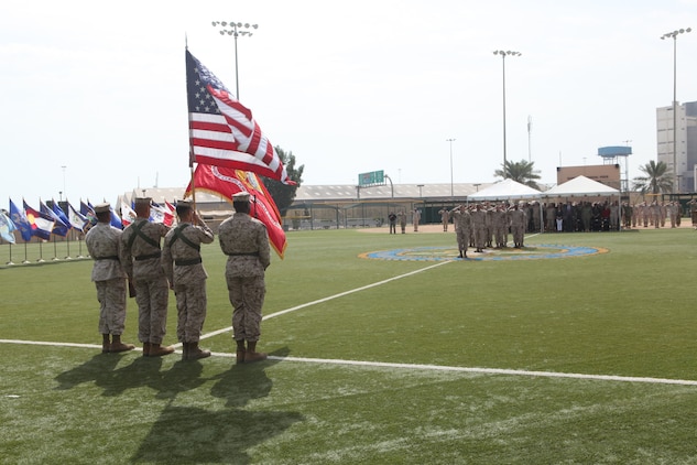 Marines, sailors and guests render honors on Naval Support Activity Bahrain as the U.S. and Kingdom of Bahrain national anthems are played during the U.S. Marine Corps Forces Central Command (Forward)’s Relief and Appointment Ceremony of outgoing sergeant major, Sgt. Maj. John J. McGovern and incoming sergeant major, Sgt. Maj. Mario A. Marquez, Feb. 12.
