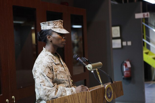 Maj. Melanie R. Bell-Carter, of Cleveland Miss., gives her parting remarks as the commanding officer of Headquarters Company, United States Marine Corps Forces Central Command (Forward).  Bell-Carter was replaced by Maj. Sally A. Falco, a Detroit native, Aug. 15 in a change of a command ceremony.  
