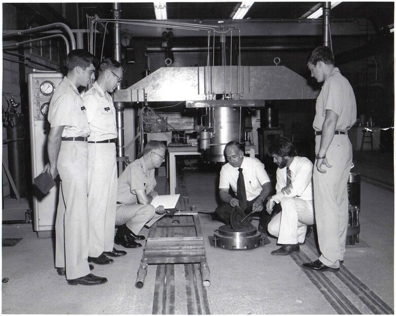 In a photo from 1978, Dr. Paul Mlakar, second from right and currently serving in a liaison position as a distinguished chair in the Department of Civil and Mechanical Engineering (CME) at West Point, explains ERDC soil testing equipment to a group of cadets including Cadet Steve Ressler, far left. Retired Brig. Gen. Ressler closed his Army career in 2013 as the head of the CME at West Point. 