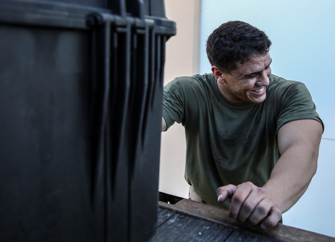 Lance Cpl. Carlos D. Vassallo, field radio operator, 15th Marine Expeditionary Unit, takes a moment to laugh during a communications exercise aboard Camp Pendleton, Calif., Jan. 6, 2014. The exercise is designed to prepare 15th MEU Marines for Exercise Iron Fist. (U.S. Marine Corps photo by Cpl. Emmanuel Ramos/Released)