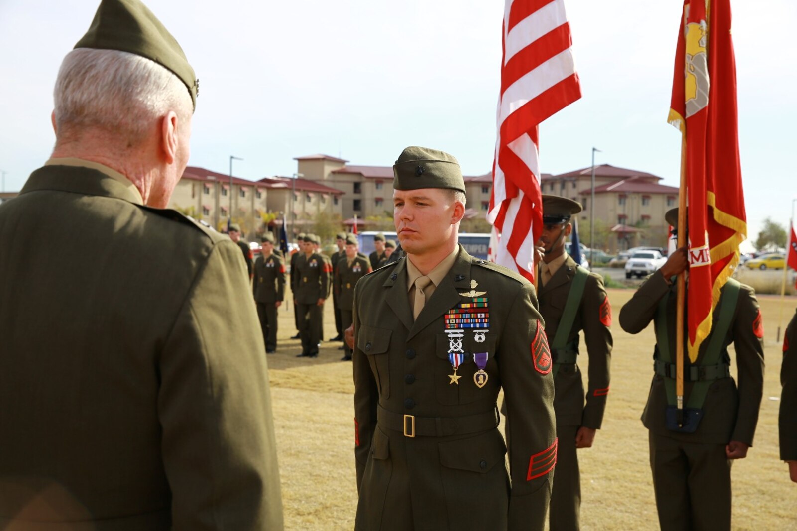 Staff Sgt. Timothy Williams, a section leader with 1st Reconnaissance Battalion, receives the Silver Star Medal and Purple Heart from Lt. Gen. John Toolan, commanding general of I Marine Expeditionary Force, during an award ceremony held at Camp Las Flores, Marine Corps Base Camp Pendleton, Calif., Jan. 7, 2014. Williams, a native of Hudson, Mich., was recognized for his heroic actions in Afghanistan when he maintained a tactical advantage while being ambushed by a larger enemy force. Williams helped save the lives of multiple Marines and destroyed several enemy positions during the 10 hour attack. (U.S Marine Corps photo by Lance Cpl. Jonathan Boynes/released)